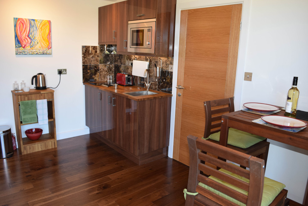 Gallery Lodges kitchen and dining area with 32 inch TV